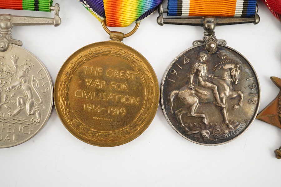 A medal group comprising of a Meritorious Service medal, a 1939 to 1945 Defence Medal, and a First World War trio awarded to 3824 SJT. F.W.G. Wakefield. R.F.A., together with a Delhi Durbar Medal 1911, crudely engraved t